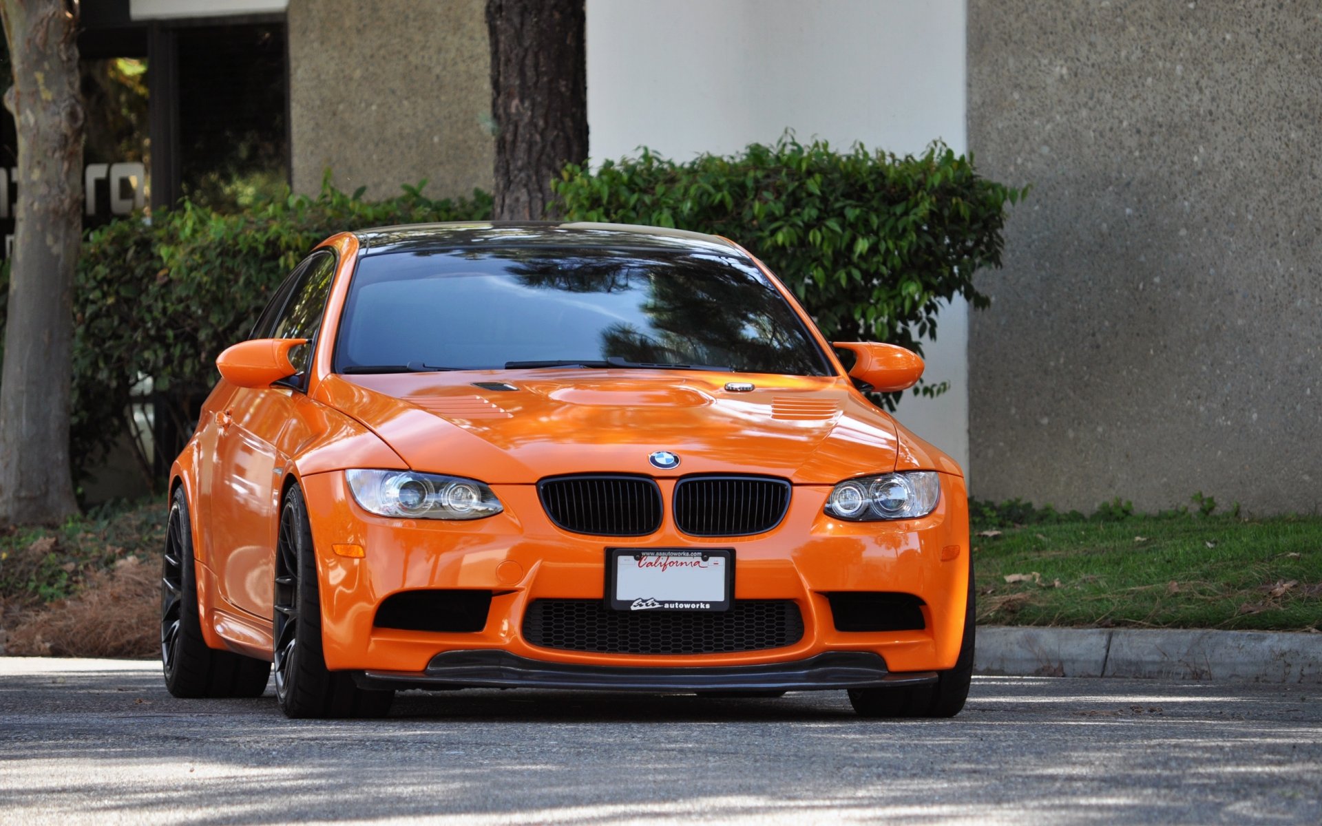 bmw m3 e92 orange.bmv orange front street road curb bush tree