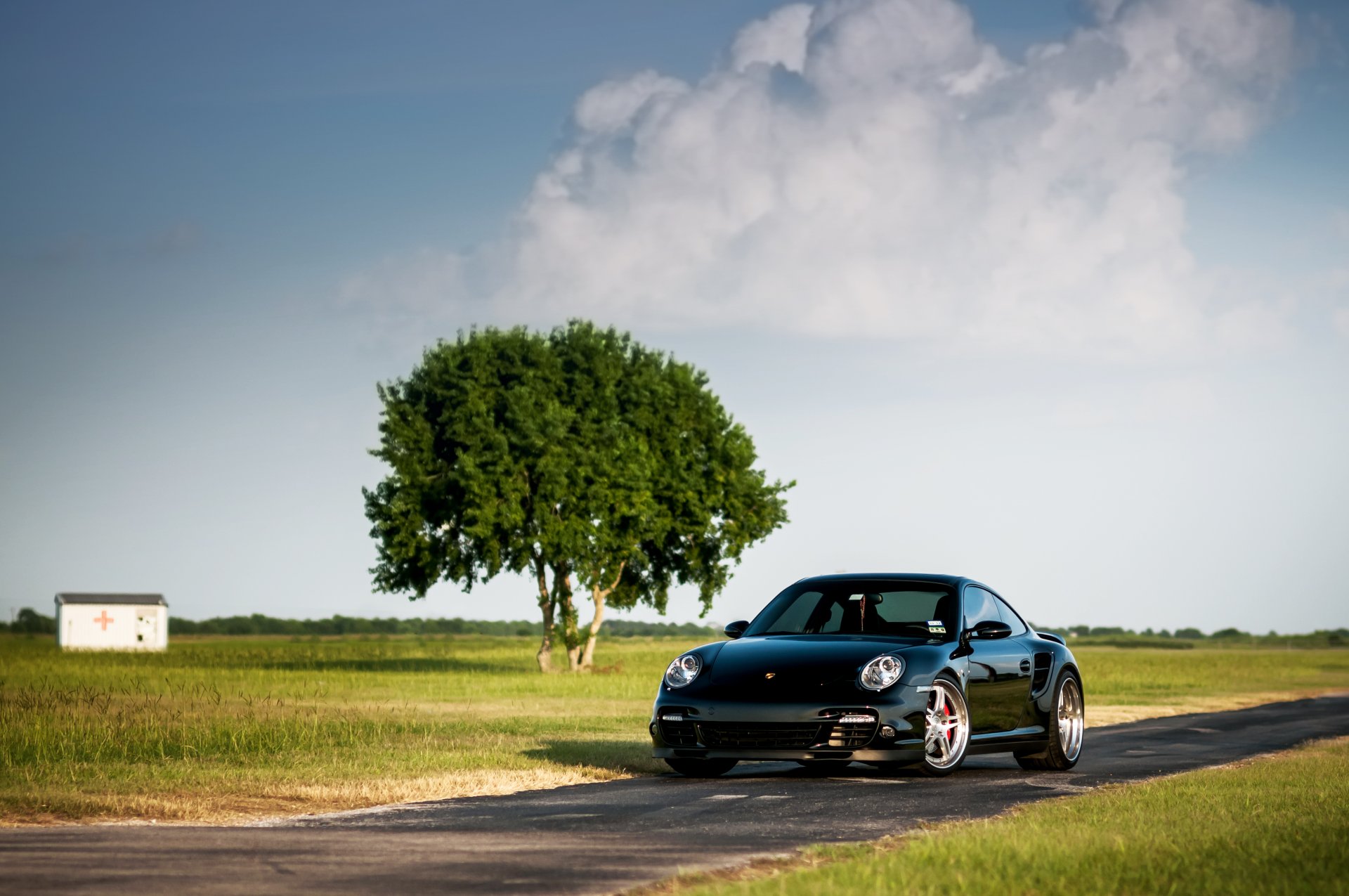 porsche 911 turbo black front porsche wood sky