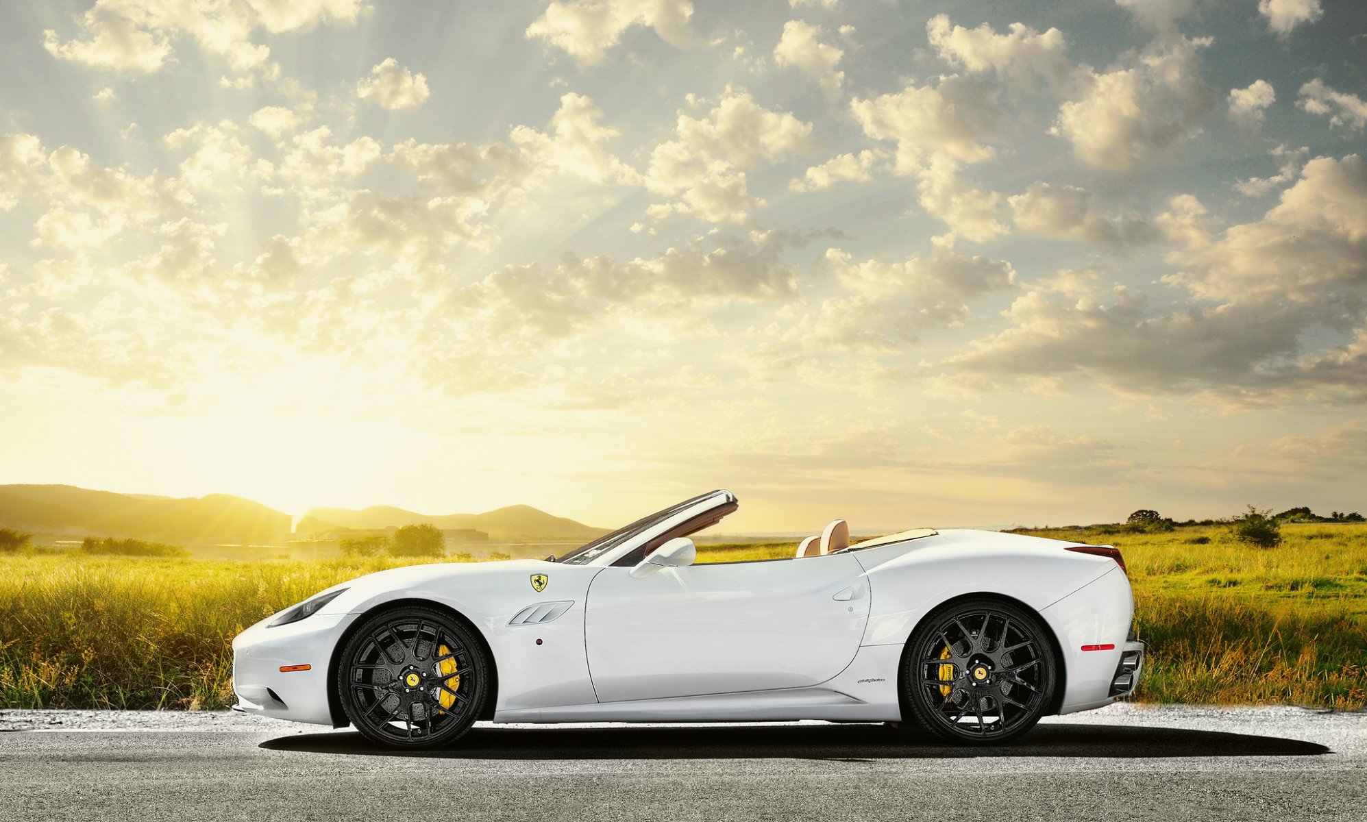 ferrari california white profile ferrari white field sun sky glare