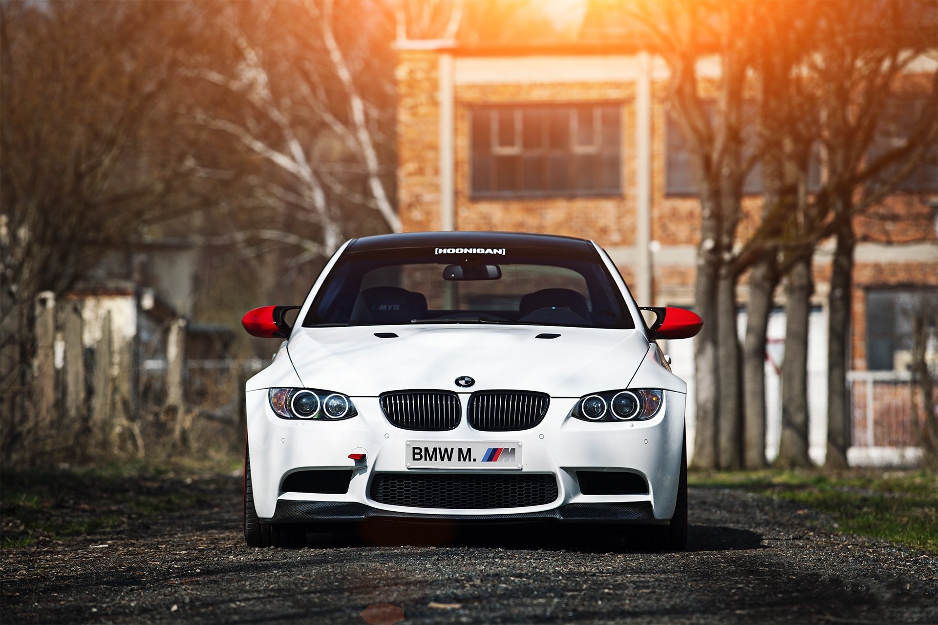 bmw m3 e92 white bmw front shade building tree