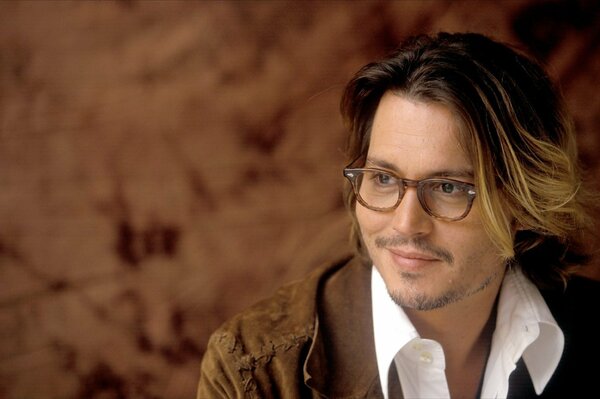 Johnny Depp smiles with glasses