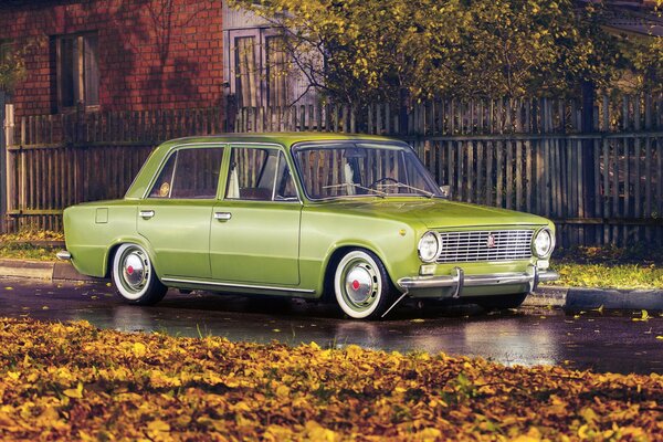 Lada-Maschine steht im Herbst in Blättern am Tor