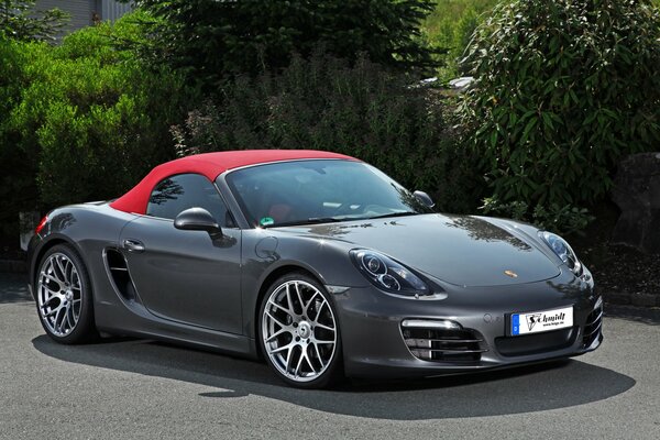 A fast car with a red roof. porsche