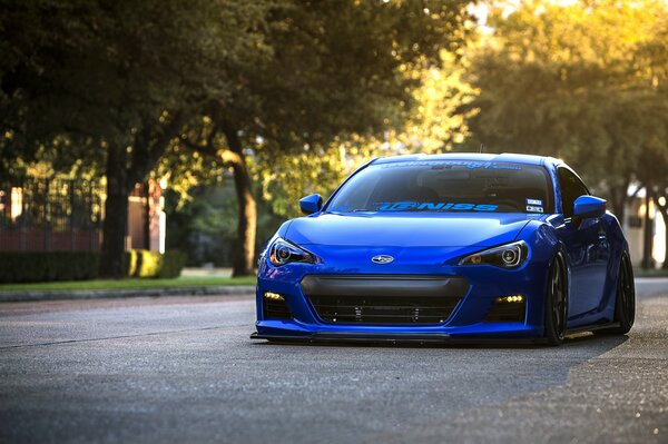 Wallpaper with a blue subaru brz on a park background