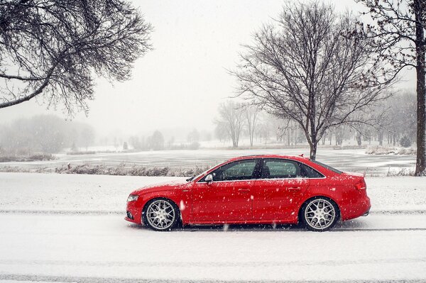 Red car on a snowy road