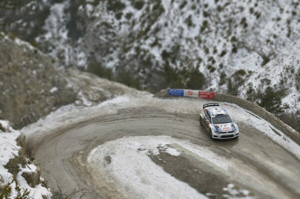 Winter road and Volkswagen polo in a skid, top view