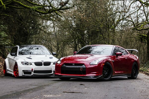 BMW e92 white car and Nissan gtr