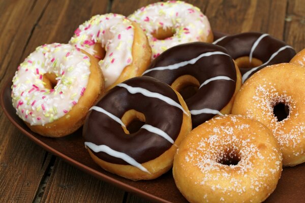 Rainbow chocolate and plain donuts