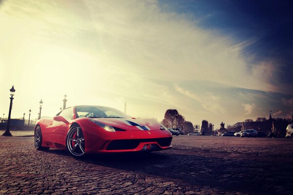 Obois red ferrari on the square in Italy