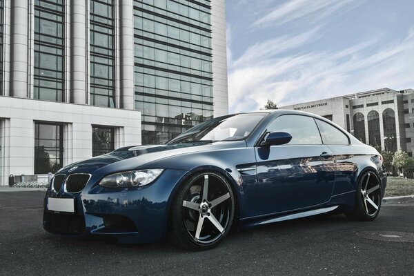 Blue BMW with alloy wheels