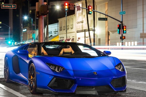 Blue Lamborghini convertible in the city