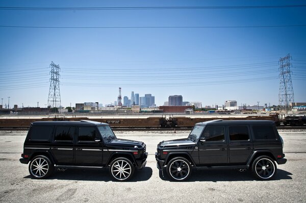 Two SUV cars are facing each other