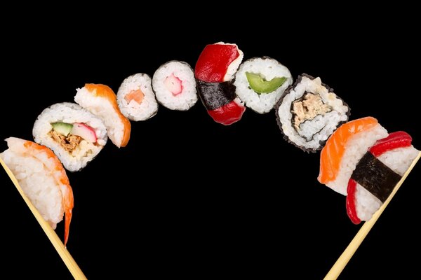 Plenty of rolls and sushi on sticks