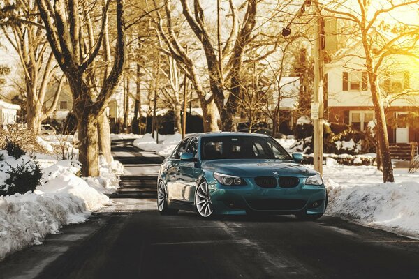 A car with a green tuning is driving around the city