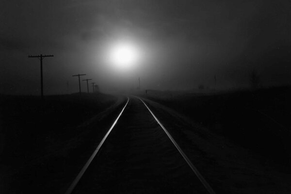 Rails in the night light. Loneliness