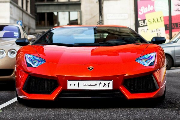 Lamborghini Orange car with Arabic license plates