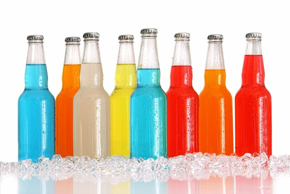 Multicolored drinks in glass bottles