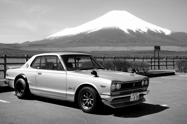 Retro Nissan on the background of a mountain in Japan