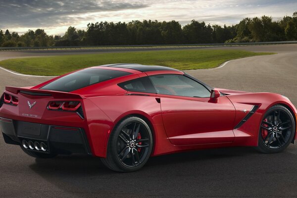 A chic red Chevrolet on the background of the road