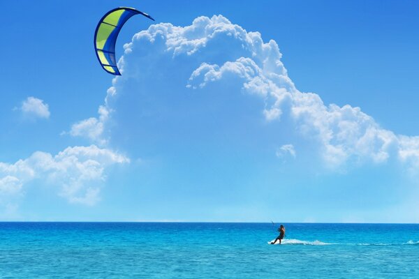 Kiting in the sea under the blue sky