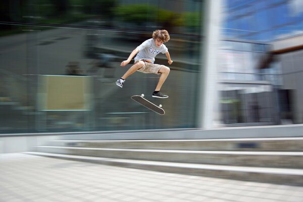 Cool jump of a boy on a board