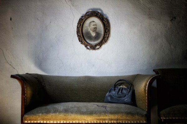 Interior with sofa and painting on the wall