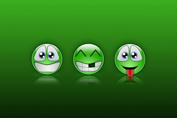 Trois smileys verts sur fond vert