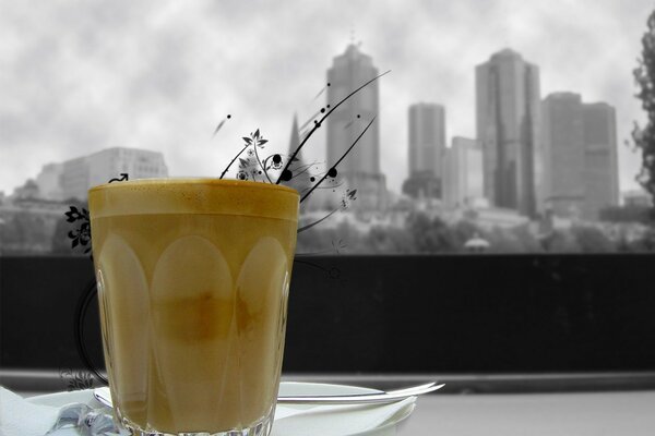 Against the background of a gray city, a cup of tea