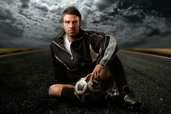 A famous football player with a ball in his hands