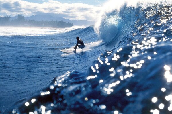 Wavesurfing on the crest of a stunning wave