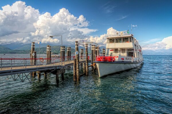 Yacht at the pier in the blue sea