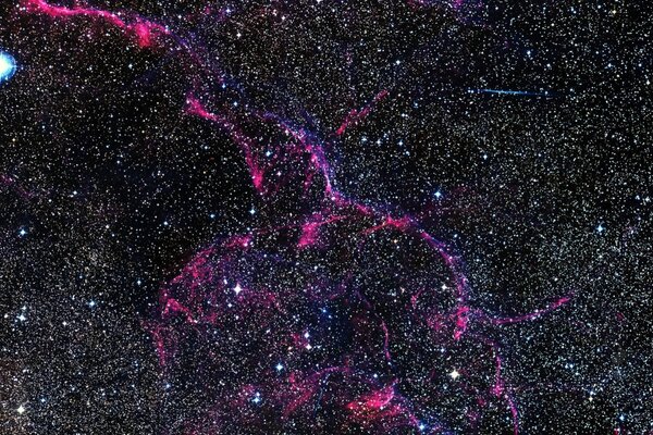 Numerosas estrellas en el espacio multicolor