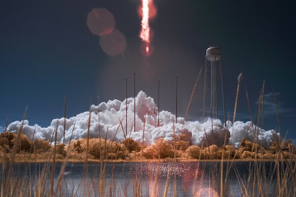 Rocket launch at a pond with grass