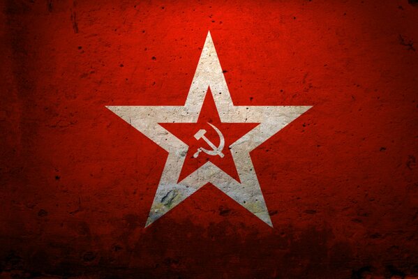 Hammer and sickle in two stars on a red background with vignetting