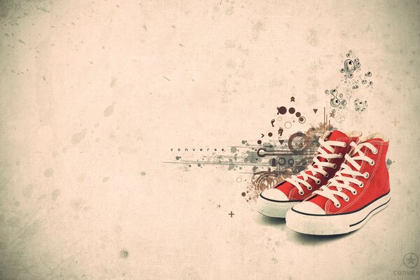 Red sneakers on the background of splashes