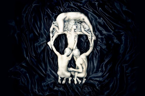 Naked people depicting a skull