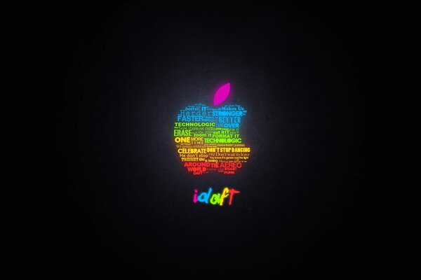 On a black background, an apple of rainbow color Apple