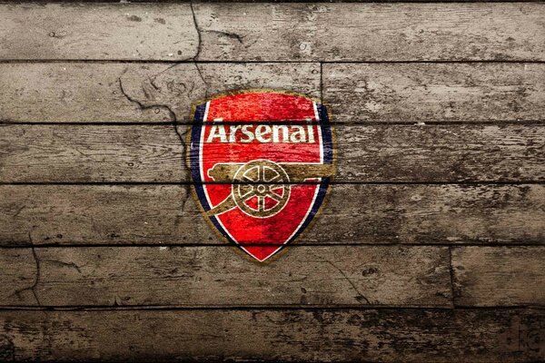 Arsenal emblem on a wooden background