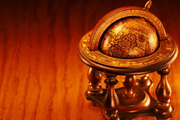 Antique globe on a wooden table