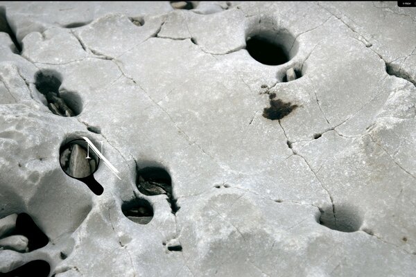 Grey natural stone with holes