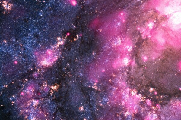 Picture of a galaxy, a bright glow in pink