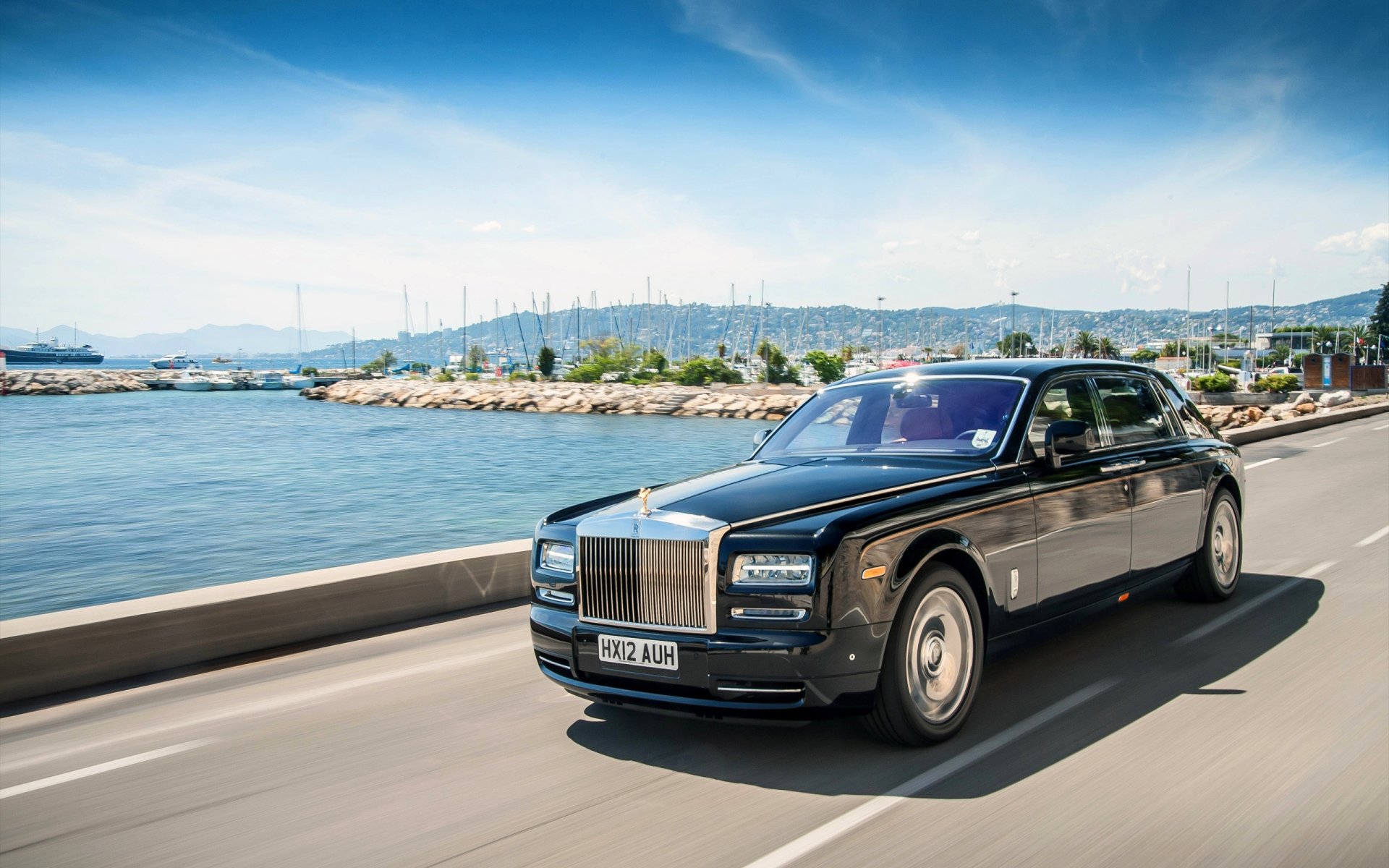 rolls royce phantom extended wheelbase wide sky sedan black water front hood