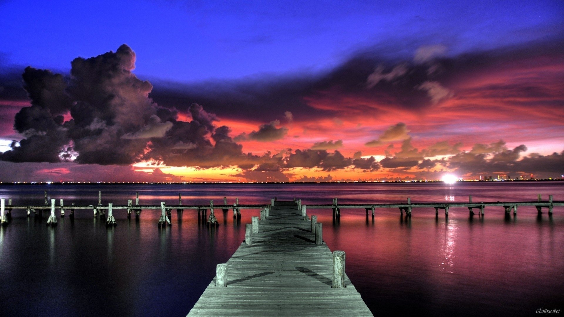 mer quai pont en bois ciel coucher de soleil