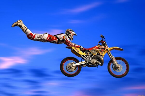 The jump of a motorcyclist during motocross