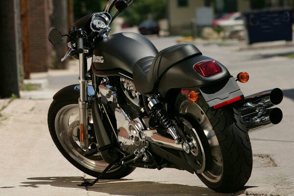 A black Harley-Davidson motorcycle. American City