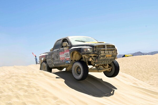 A black jeep participates in an off-road race