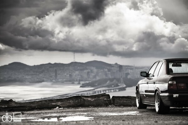 Bmw classic on the background of a mountain city