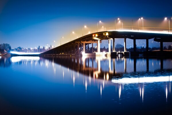 Night bridge, reflected in the water