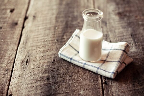 A bottle of milk on a linen napkin