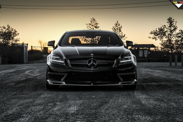 Black mercedes-benz cls 63 amg vorsteiner on sunset water